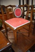 An Edwardian mahogany corner chair having line inlay decoration