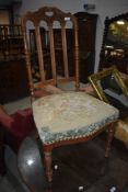 A late 19th or early 20th Century stripped mahogany bedroom chair having overstuffed seat with