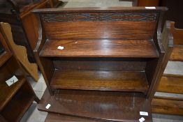 An Arts and Crafts style low bookshelf