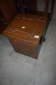 An Arts and Crafts copper coal bucket of square form