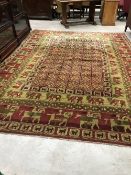 A traditional carpet square having animalistic decoration