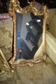 A gilt frame wall mirror