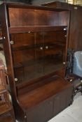 A vintage style dark stained and smoked glass lounge unit , nice size at just 100cm wide