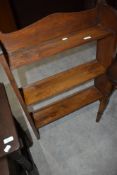 An Arts and Crafts style low bookshelf