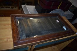 An oak framed wall mirror, approx. 53 x 30cm