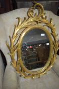 A gilt framed wall mirror
