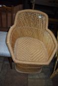 A wickerwork tub chair