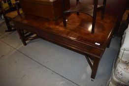 A reproduction mahogany coffee table