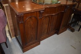 A Victorian mahogany sideboard having shaped front , width approx. 153cm