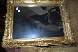A gilt frame wall mirror