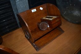 An Arts and Crafts style book trough or stationery rack etc