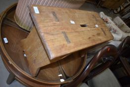 A rustic stripped pine wide stool, width approx. 58cm