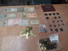 A collection of World Banknotes, Coins and Tokens including a small amount of Silver, a good
