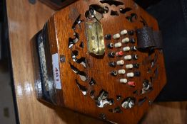 A traditional 48 button concertina, probably Lachenal late 19th/early 20th Century, some splitting