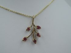 A ruby set 9ct gold pendant modelled as a branch on a 9ct gold chain, approx 18' & 4.2g