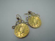 A pair of yellow metal American 1 dollar coin earrings dated 1853 on fixed loop drops, approx 3.9g