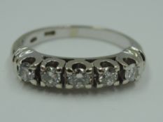 A diamond half eternity ring having five brilliant cut diamonds, total approx 0.46ct in a claw set