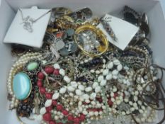 A selection of costume jewellery including pendants, brooches, bracelets etc