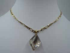 A 9ct gold figaro link chain with magnetic clasp, approx 18' & 10.2g with a smoky cut glass pendant