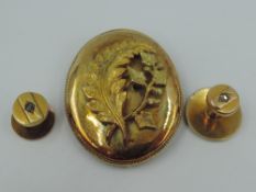 Two yellow metal shirt studs having diamond chip insets and a yellow metal pendant having applique