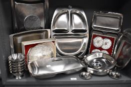 A selection of stainless steel kitchen wares and serving trays
