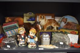 A selection of ceramics and kitchen wares including figures and jelly molds