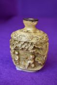 A Chinese style snuff or scent bottle having traditional decoration
