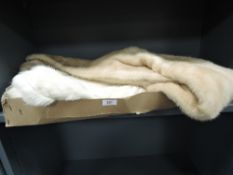 A vintage white coney shrug and a blonde mink wrap.