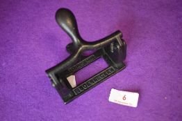 An antique hole punch ' D.R.G.M F.SOENNECKEN'