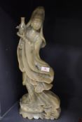 A large standing soap stone carved figure of a Chinese temple dancer standing approx 50cm tall