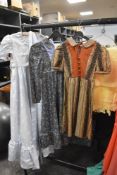 A collection of childrens vintage dresses.