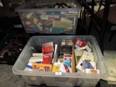 A selection of cigarette and similar advertising packets over three box full