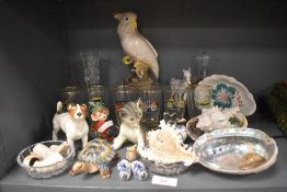 A selection of cocktail glasses and trinkets including figures