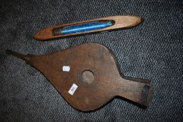 A set of oak bellows and a factory weaving shuttle
