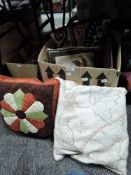 A mixed box of vintage and similar cushions.