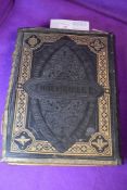 A Victorian family bible having brass edging and some colour plates.