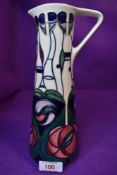 A 1990s Moorcroft jug having Rennie Macintosh style design.