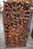 A richly carved wooden three dimensional Eastern wall hanging, extensive detail throughout.