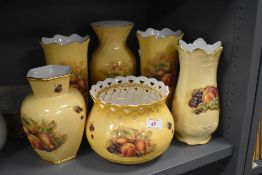 A selection of vase by Aynsley in the Orchard Gold design
