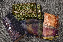 A collection of vintage shawls, various fabrics and eras.