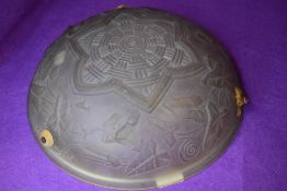 A pressed glass art deco ceiling light shade having ivy and geometric design