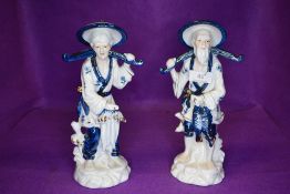 A pair of porcelain figure studies of fishermen