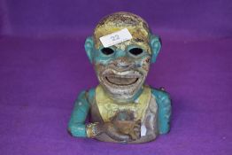 A vintage mechanical Money Bank.