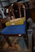 A Gothic style part oak hall chair having later upholstered seat and a woolwork kneeling pad