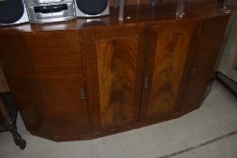 An early to mid 20th Century sapele sideboard having stepped design, with central double cupboard