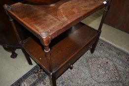 An early 20th Century oak tea trolley of large proportions with drawer to lower tier, dimensions