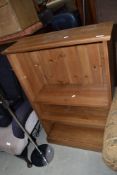 A set of modern pine effect bookshelves