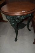 A traditional Britannia style pub table having mahogany top, diameter approx. 65cm
