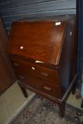 An early 20th century oak bureau of small proportions