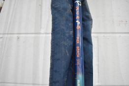 Two fishing rods in nylon cases.